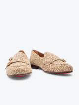 Front view of limited edition Trace 1989 Monk slippers. Handwoven Boucle cloth, subtle suede trim, gold metal buckles, cemented onto a leather sole with stacked leather heel finished with gold buckles.
