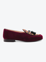 Side view of limited edition Leo 1976 Maroon Belgian slipper. Meticulously handwoven jacquard cloth with full grain leather trims set onto a leather sole with stacked leather heel.