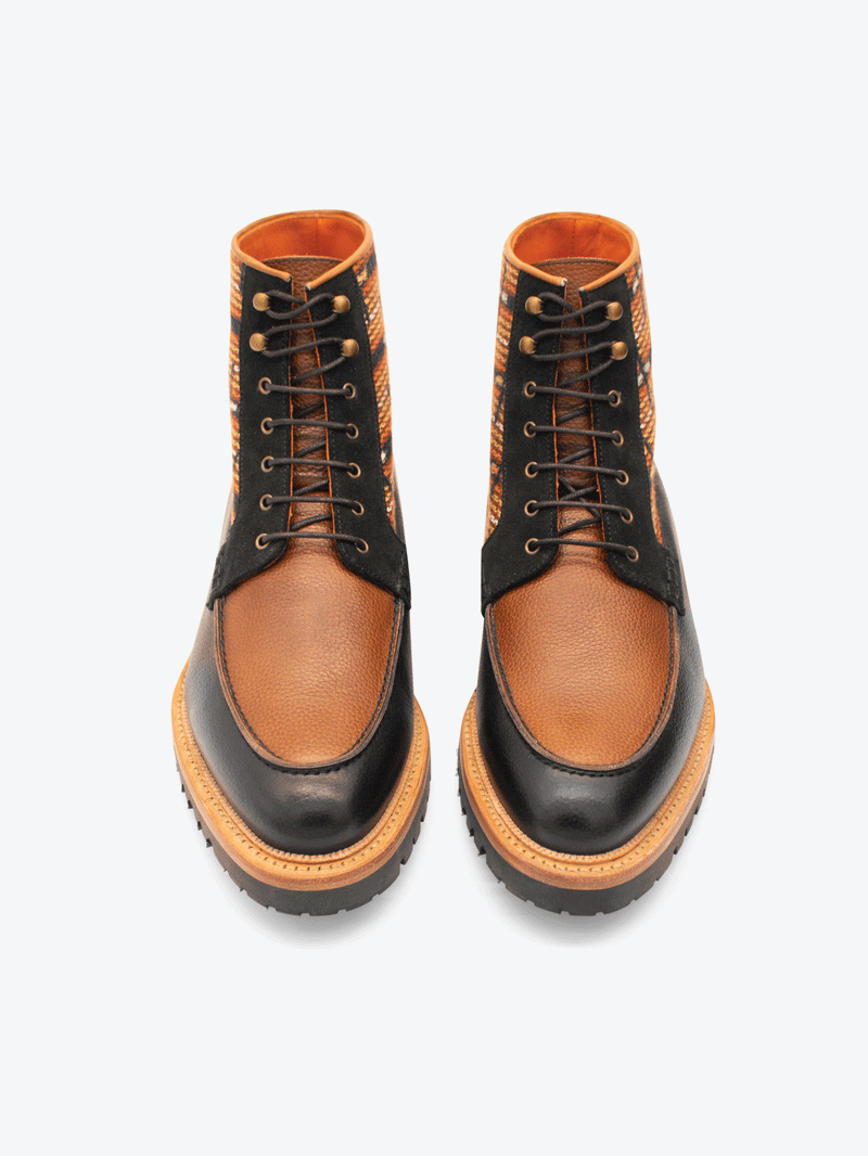 Above view of limited edition Brooklyn 1997 Symmetry Moc Boot. Handcrafted jacquard cloth with luxurious Italian suede, fullgrain black and cognac leather, lasted on our commando sole using the Goodyear method with storm welt